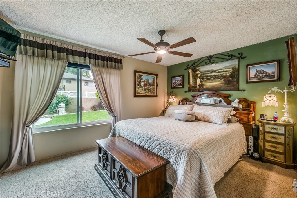 2073 Suede Avenue Simi Valley, CA 93063 - Photo 12 of 33 a bedroom with a bed next to a window