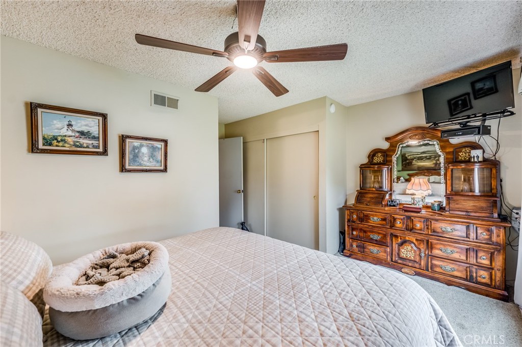 2073 Suede Avenue Simi Valley, CA 93063 - Photo 13 of 33 a bedroom with a bed and furniture