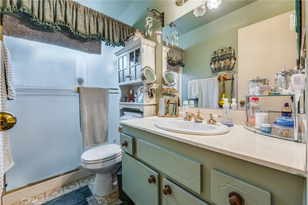 2073 Suede Avenue Simi Valley, CA 93063 - Photo 14 of 33 a bathroom with a sink a toilet and shower