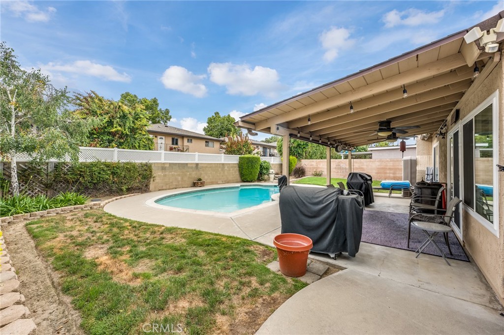 2073 Suede Avenue Simi Valley, CA 93063 - Photo 22 of 33 a view of a patio with table and chairs potted plants with sky view