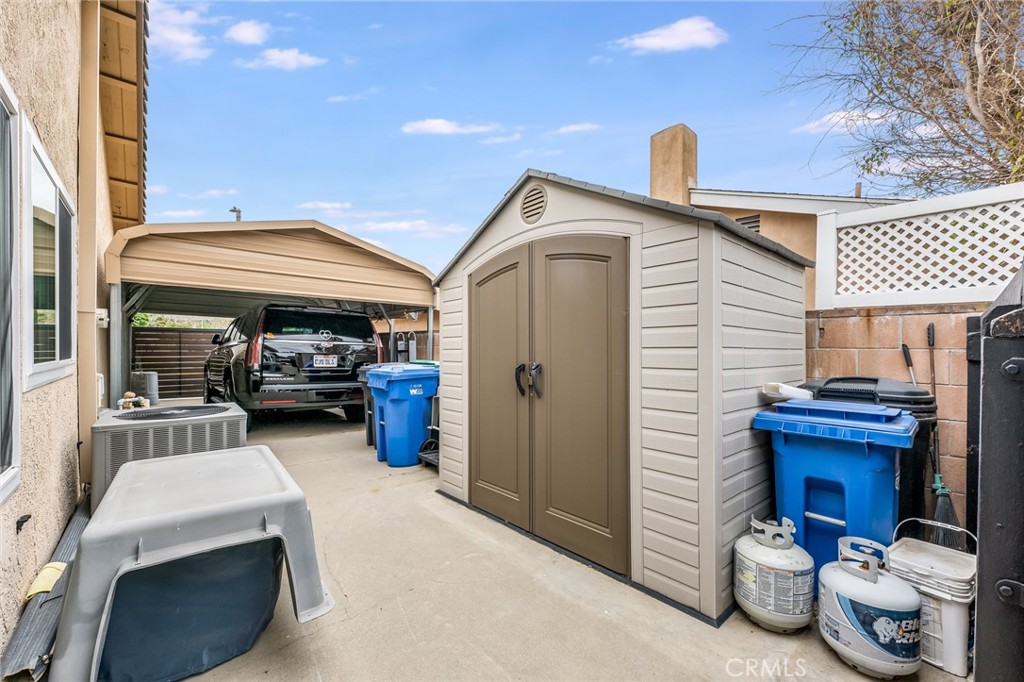 2073 Suede Avenue Simi Valley, CA 93063 - Photo 24 of 33 a view of the patio with dining table and chairs