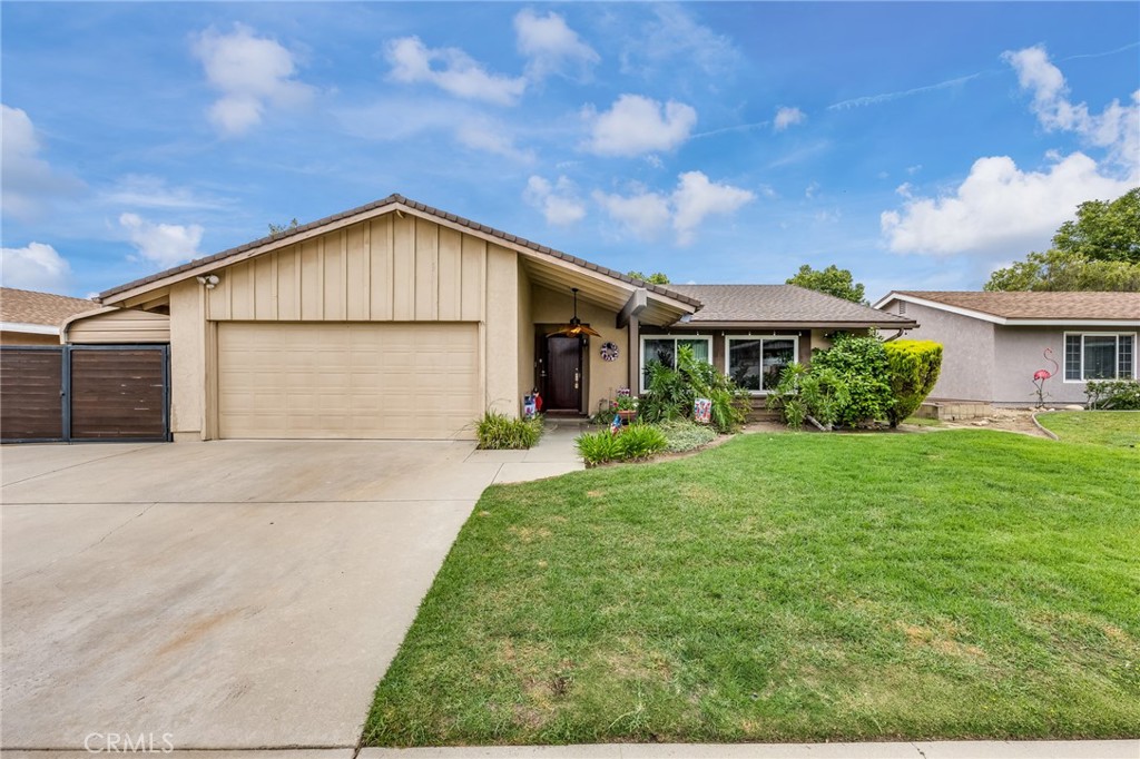 2073 Suede Avenue Simi Valley, CA 93063 - Photo 27 of 33 a front view of a house with a yard