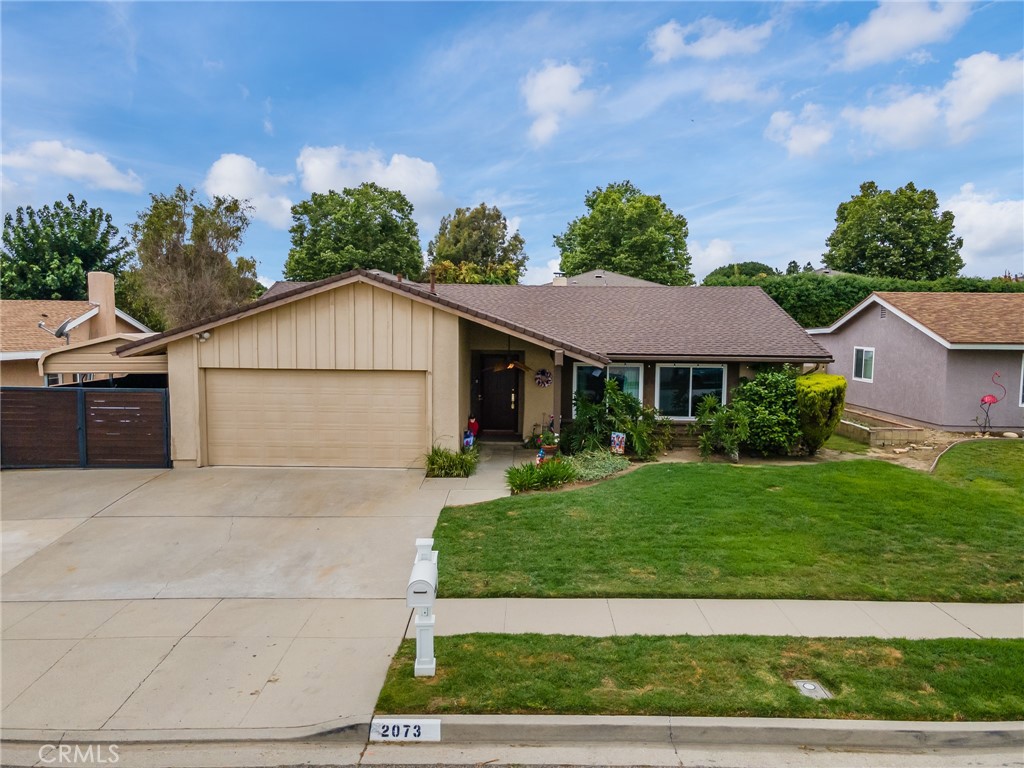 2073 Suede Avenue Simi Valley, CA 93063 - Photo 29 of 33 a front view of a house with a yard