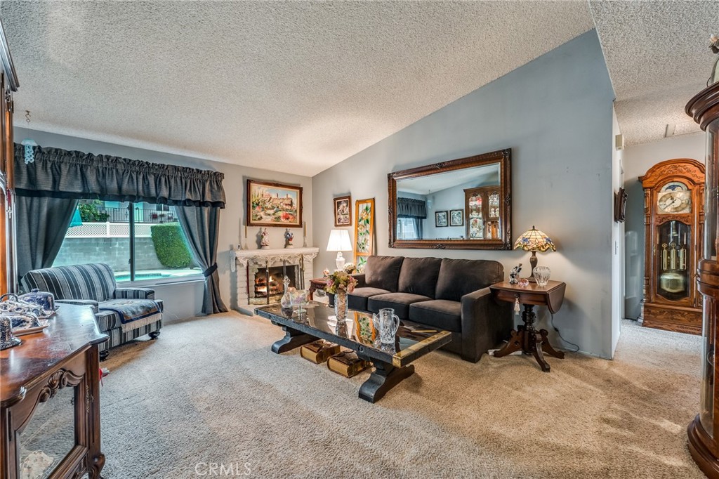 2073 Suede Avenue Simi Valley, CA 93063 - Photo 3 of 33 a living room with furniture and a floor to ceiling window