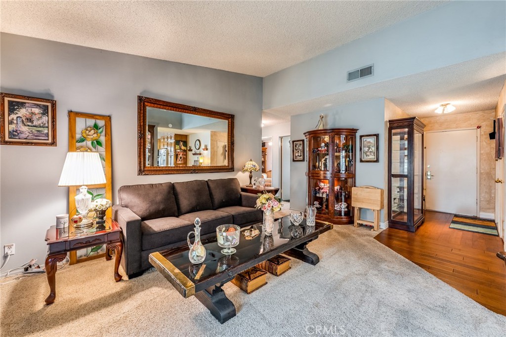 2073 Suede Avenue Simi Valley, CA 93063 - Photo 4 of 33 a living room with furniture and a table