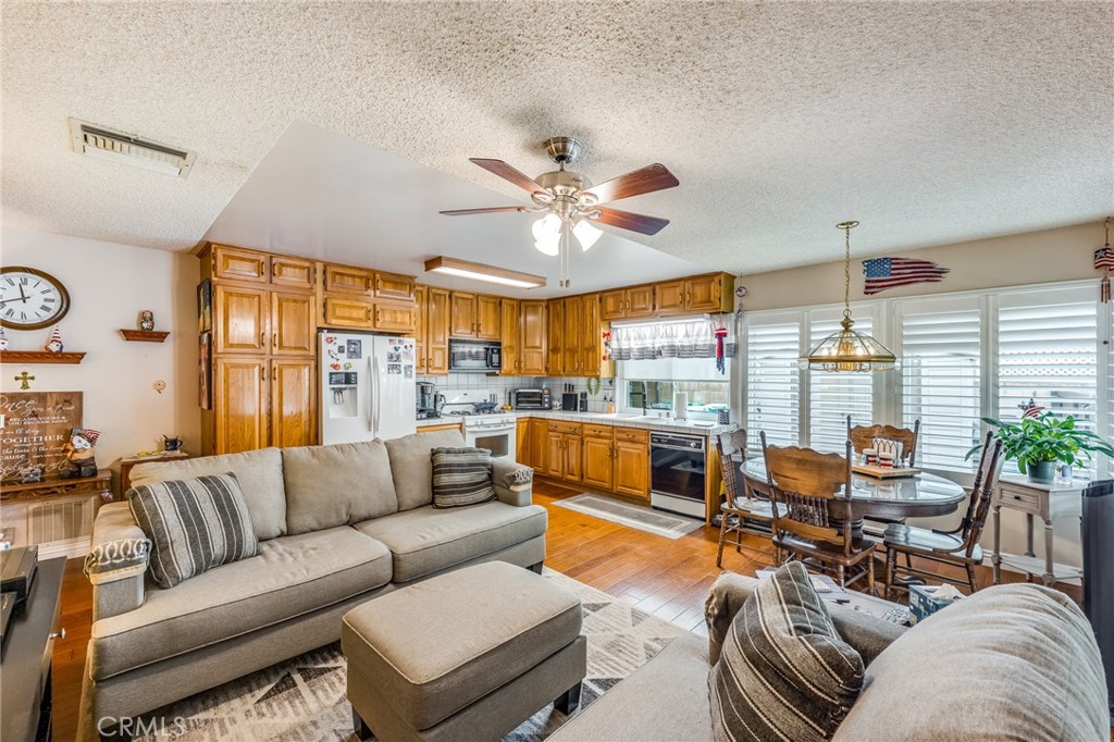 2073 Suede Avenue Simi Valley, CA 93063 - Photo 8 of 33 a living room with furniture kitchen view and a large window