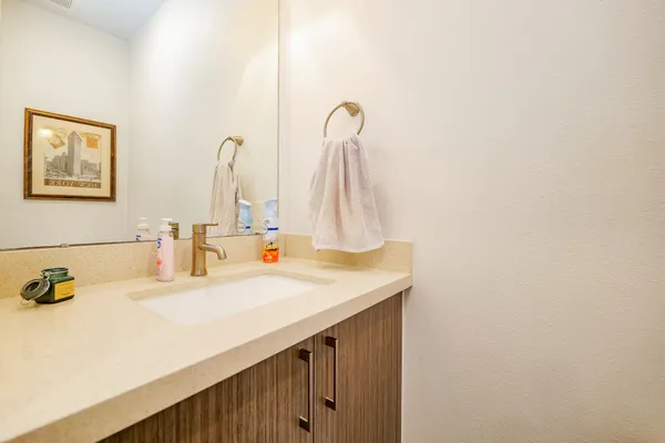 a bathroom with a sink and a mirror