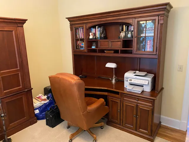 a view of workspace with wooden floor windows