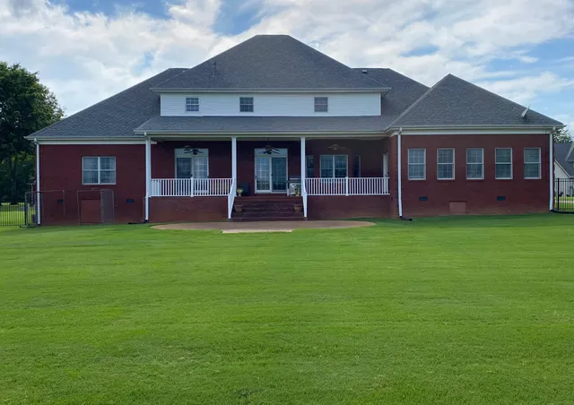 a front view of a house with a yard