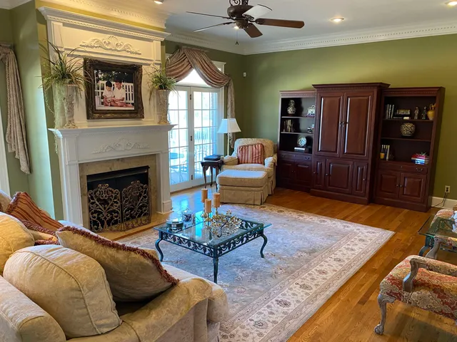 a living room with furniture rug and window