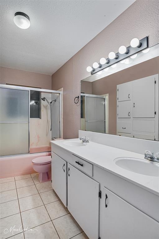 821 Princeton Road Princeton, LA 71067 - Photo 11 of 26 a bathroom with a sink a toilet and mirror