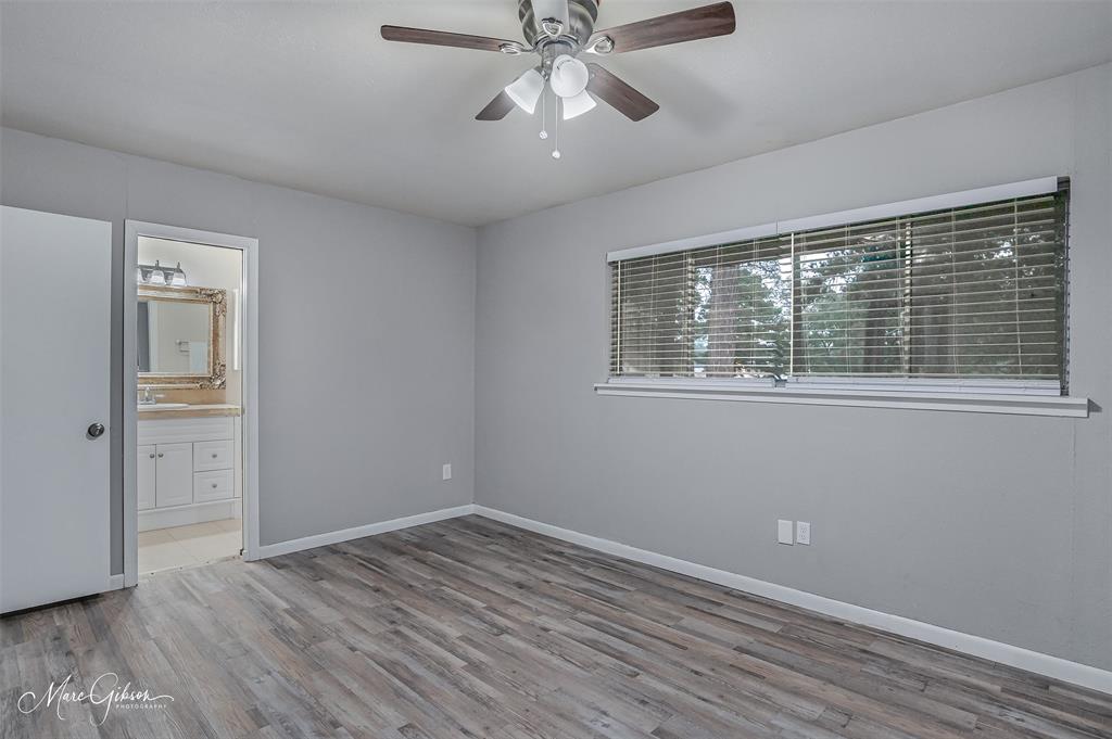 821 Princeton Road Princeton, LA 71067 - Photo 12 of 26 a view of an empty room with wooden floor and a window