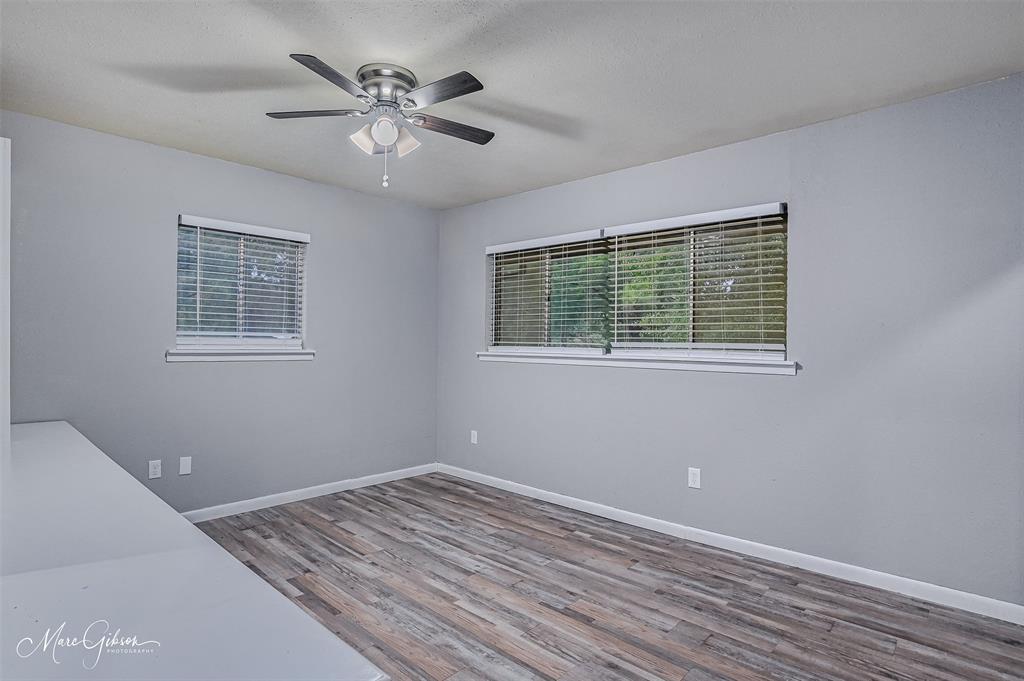 821 Princeton Road Princeton, LA 71067 - Photo 14 of 26 a view of an empty room with a window and a ceiling fan