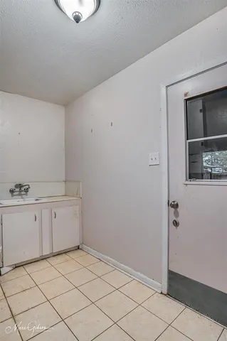 a room with white cabinets