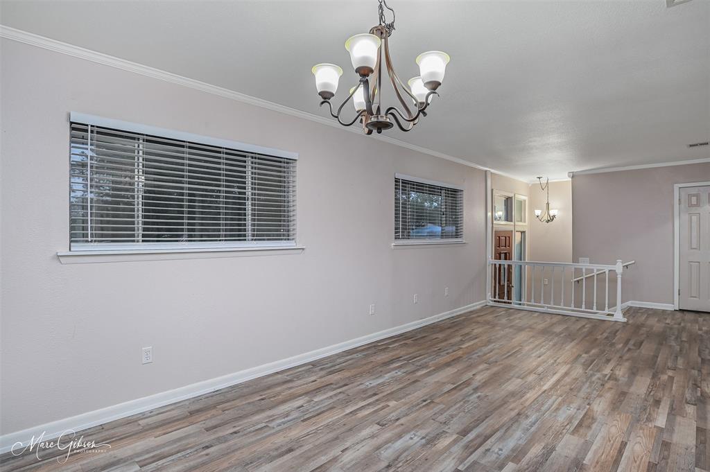 821 Princeton Road Princeton, LA 71067 - Photo 5 of 26 a view of a livingroom with a chandelier
