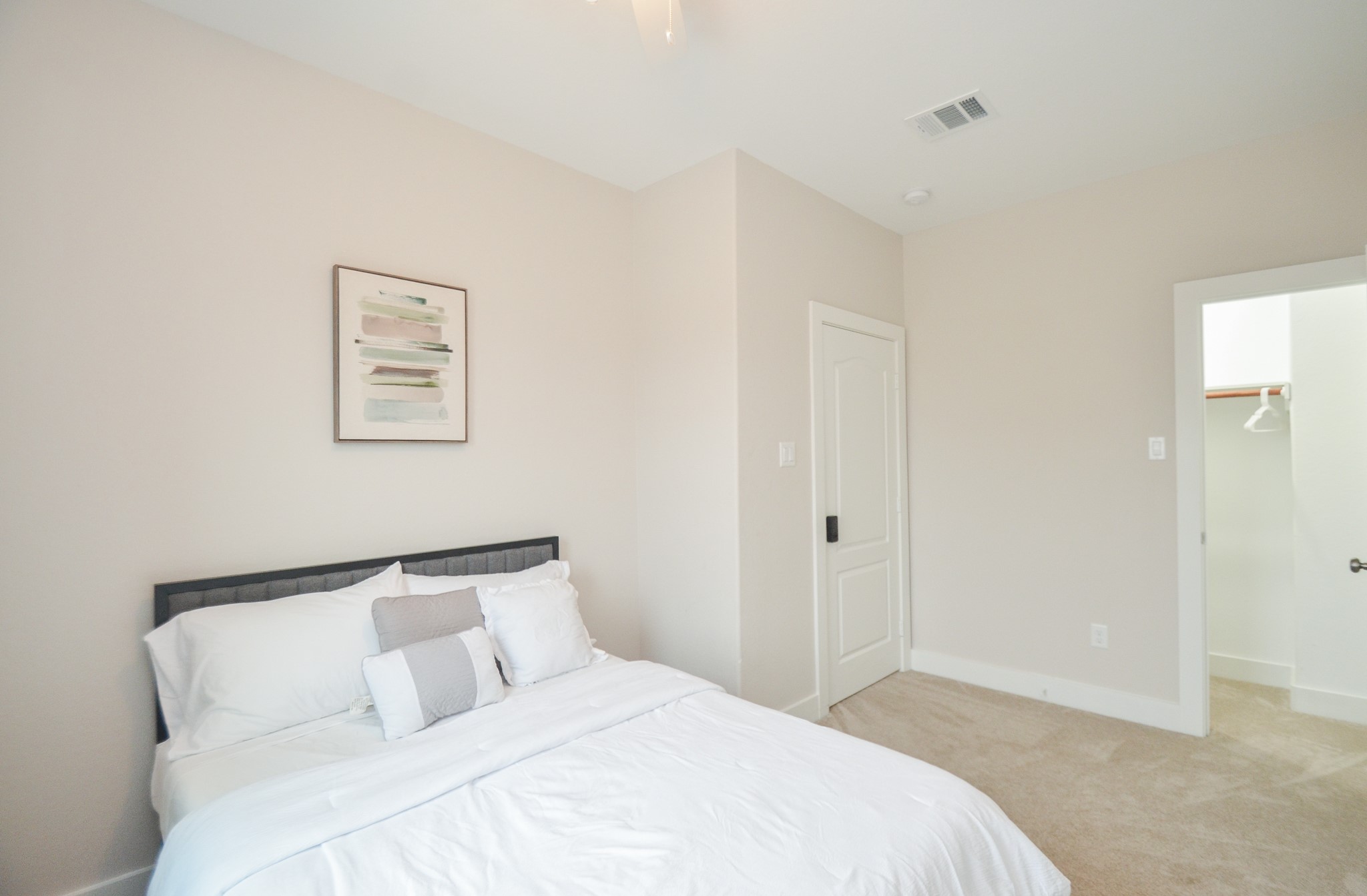 4511 Reed Road Houston, TX 77051 - Photo 23 of 39 a bedroom with a bed and a painting on the wall