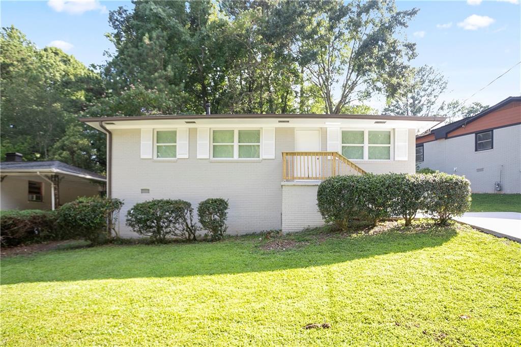 a front view of a house with garden