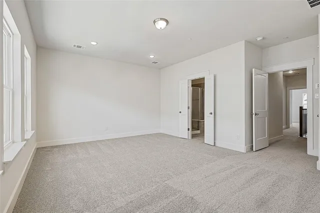 a bathroom with double sink and a mirror