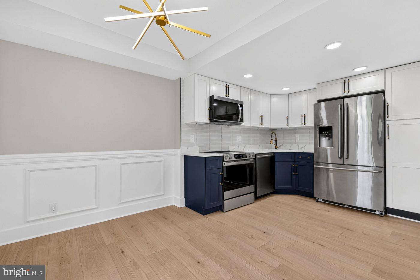 1401 North Rhodes Street, Unit 604 Arlington, VA 22209 - Photo 9 of 25 Blue & White Cabinets