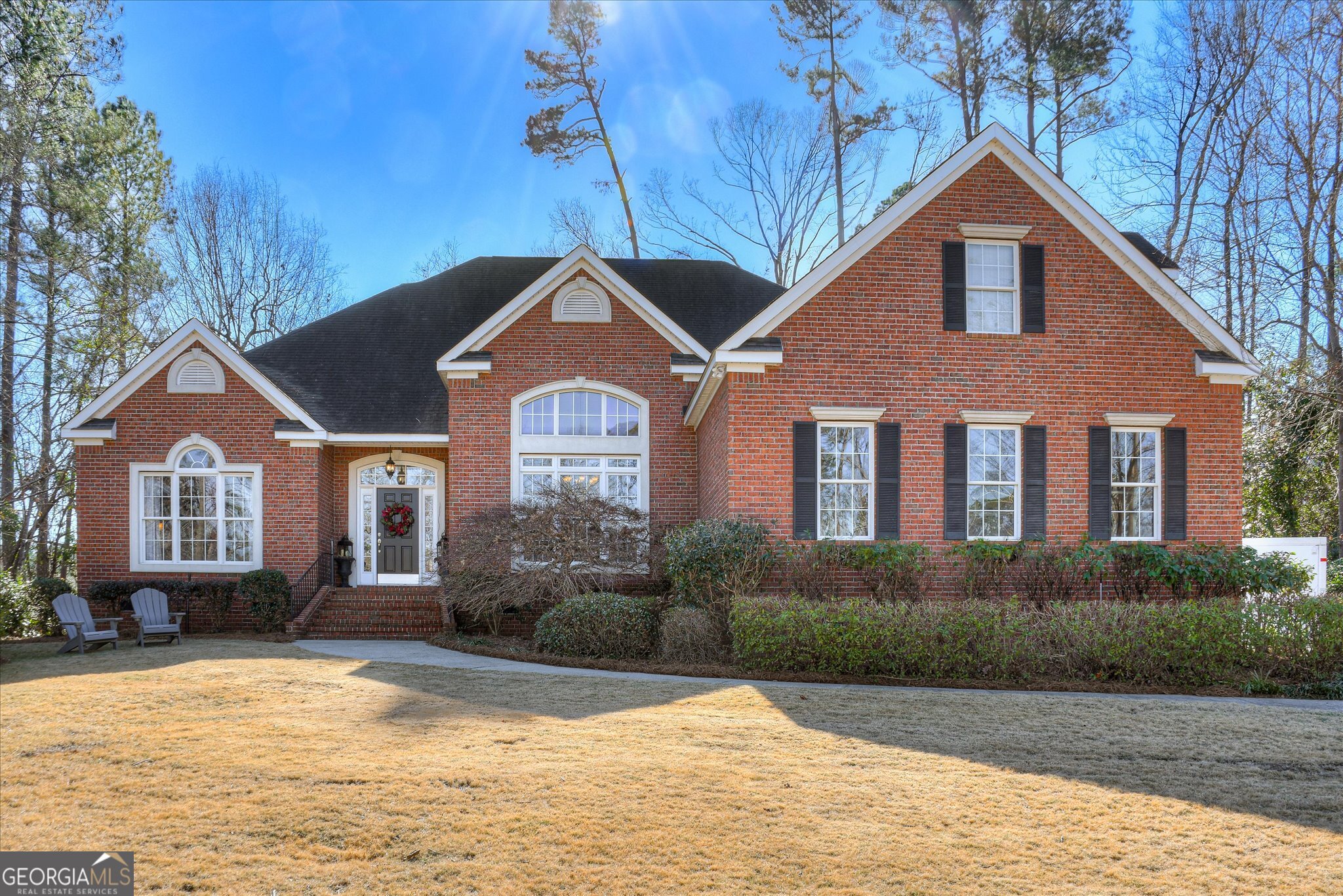 a front view of a house with a yard
