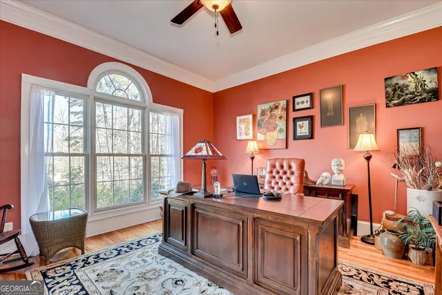 a living room with fireplace furniture and a wooden floor