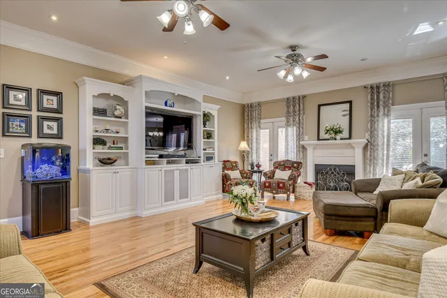 a view of a dining room with furniture wooden floor and chandelier