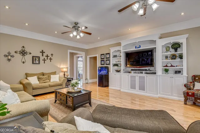 a kitchen with stainless steel appliances granite countertop a sink refrigerator and cabinets