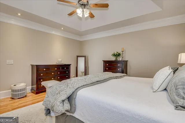 a spacious bathroom with a tub sink and mirror