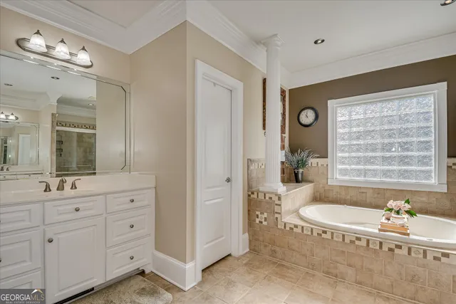 a spacious bedroom with a bed a window and dresser