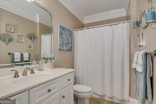 a bedroom with a bed and a chair