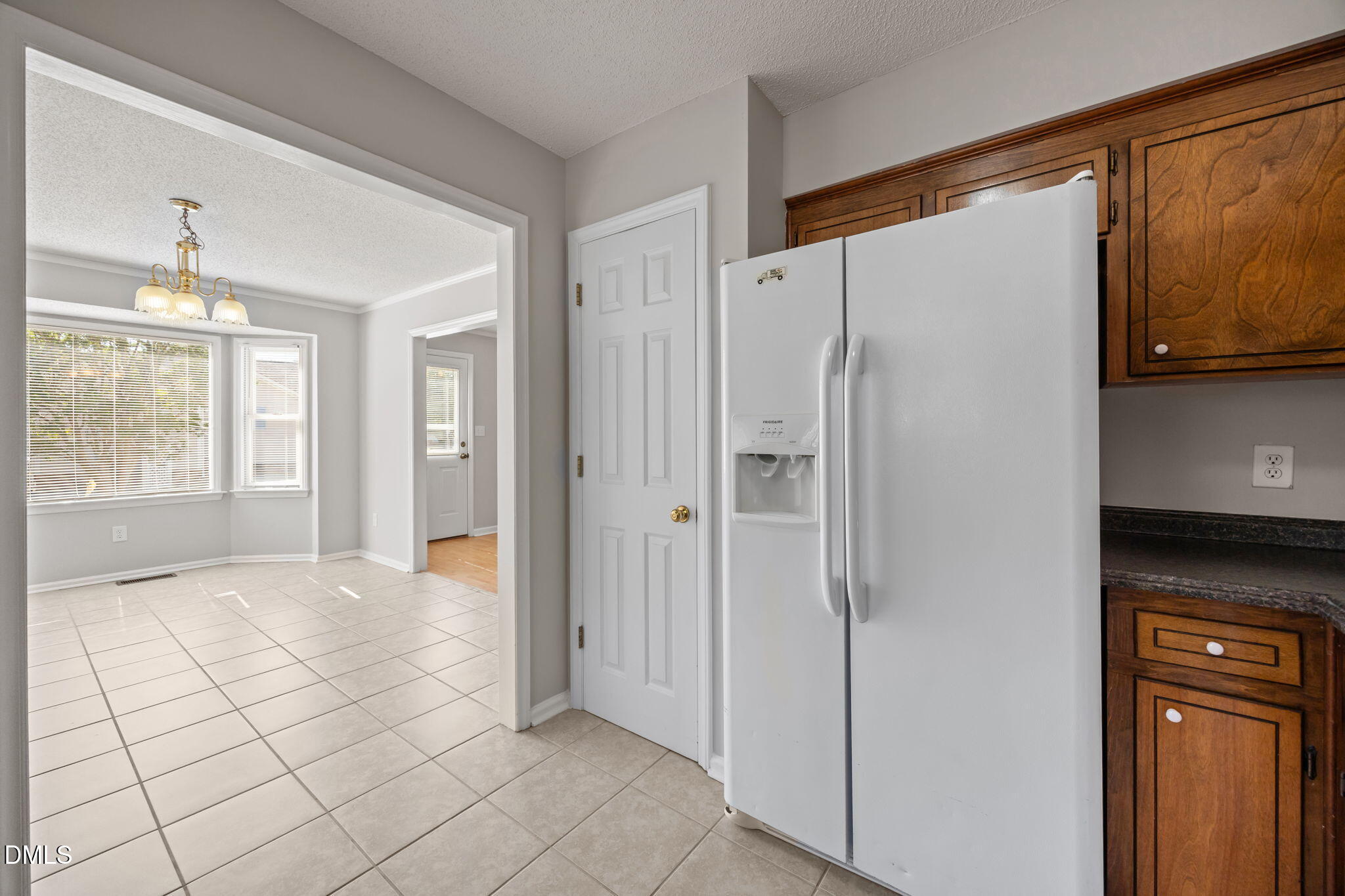 40 Circle Tree Lane Angier, NC 27501 - Photo 17 of 39 a view of an empty room with window and cabinet