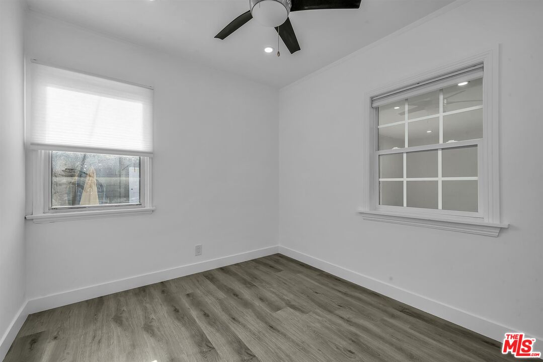 121 North Doheny Drive Beverly Hills, CA 90211 - Photo 13 of 20 an empty room with a window