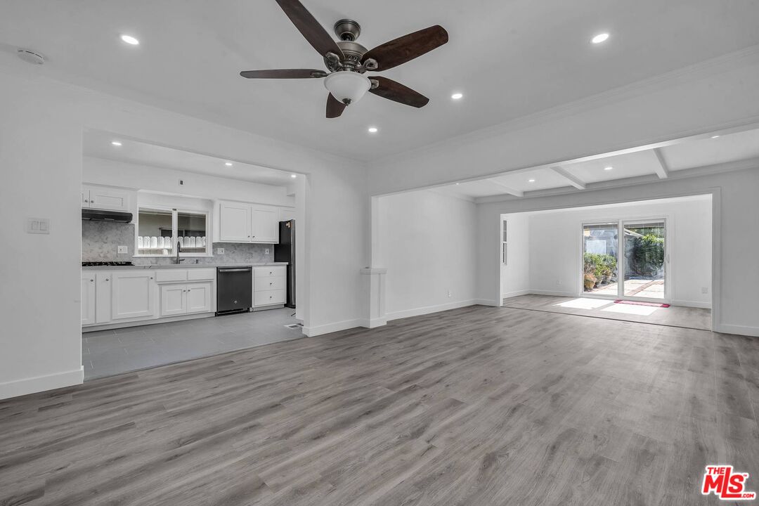 121 North Doheny Drive Beverly Hills, CA 90211 - Photo 5 of 20 a view of a kitchen with a sink and a stove top oven