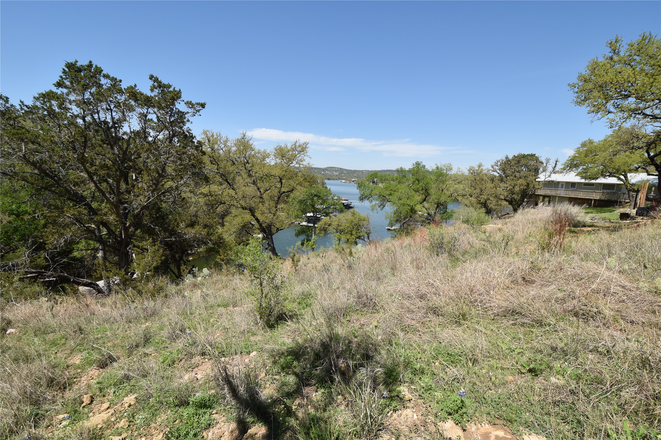 # Sunset Cliff Road Burnet, TX 78611 - Photo 5 of 12 View of undeveloped land with a nearby body of water