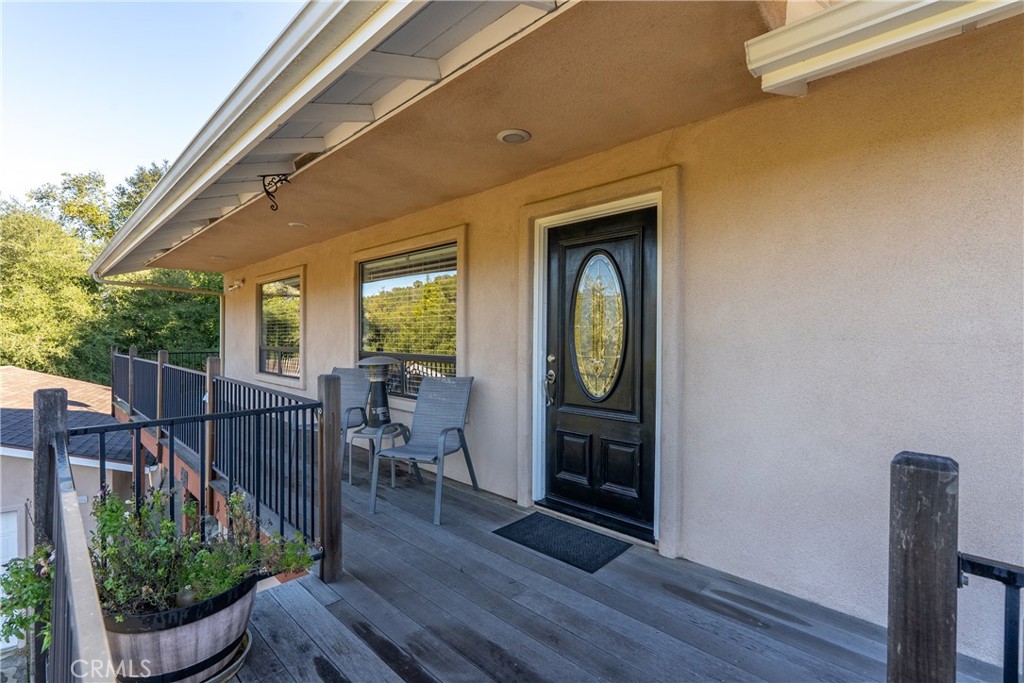a view of balcony with furniture and wooden floor