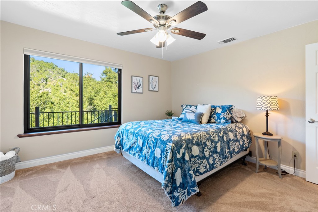 8505 Santa Cruz Road Atascadero, CA 93422 - Photo 22 of 59 a bedroom with a bed and a window