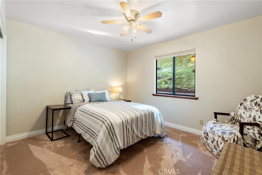 8505 Santa Cruz Road Atascadero, CA 93422 - Photo 23 of 59 a bedroom with a bed and a window