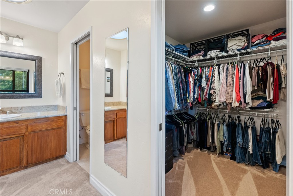 8505 Santa Cruz Road Atascadero, CA 93422 - Photo 30 of 59 a view of walk in closet with clothes and shoes