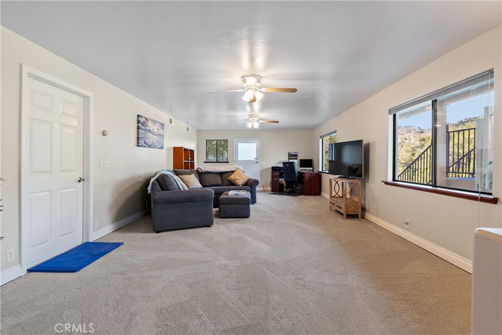 8505 Santa Cruz Road Atascadero, CA 93422 - Photo 35 of 59 a living room with furniture and a chandelier