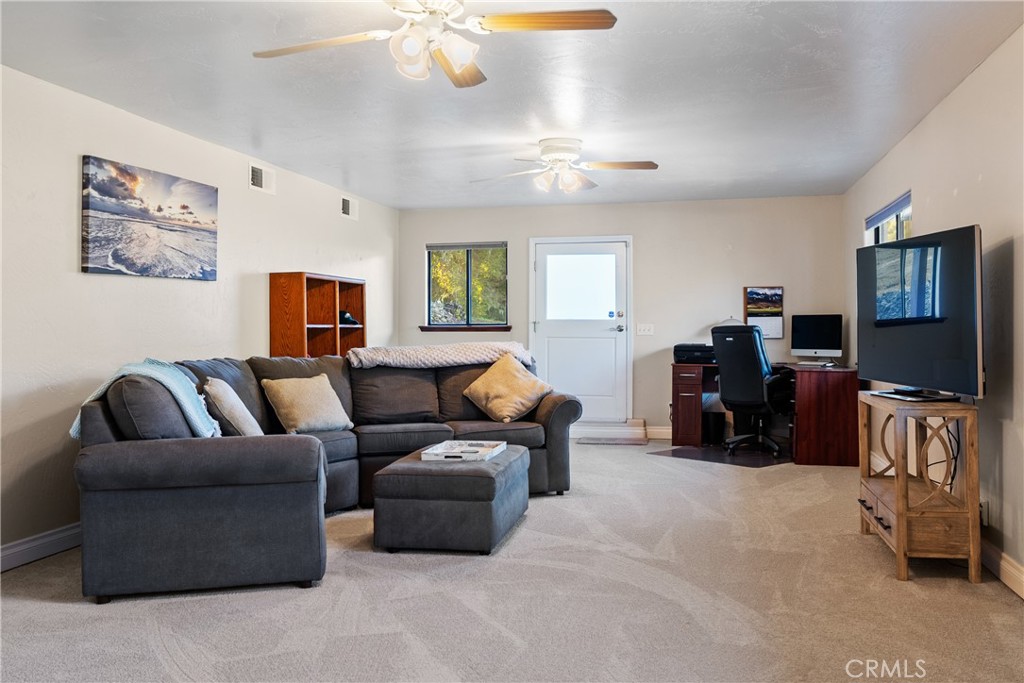 8505 Santa Cruz Road Atascadero, CA 93422 - Photo 36 of 59 a living room with furniture and a flat screen tv