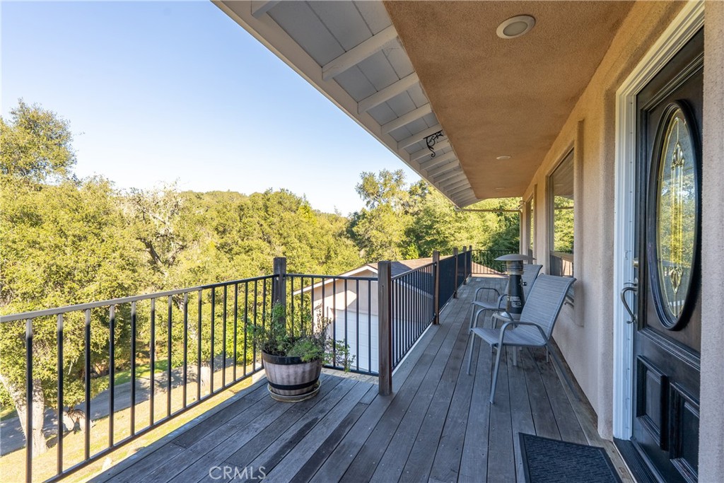 8505 Santa Cruz Road Atascadero, CA 93422 - Photo 7 of 59 a view of a balcony with furniture and wooden floor