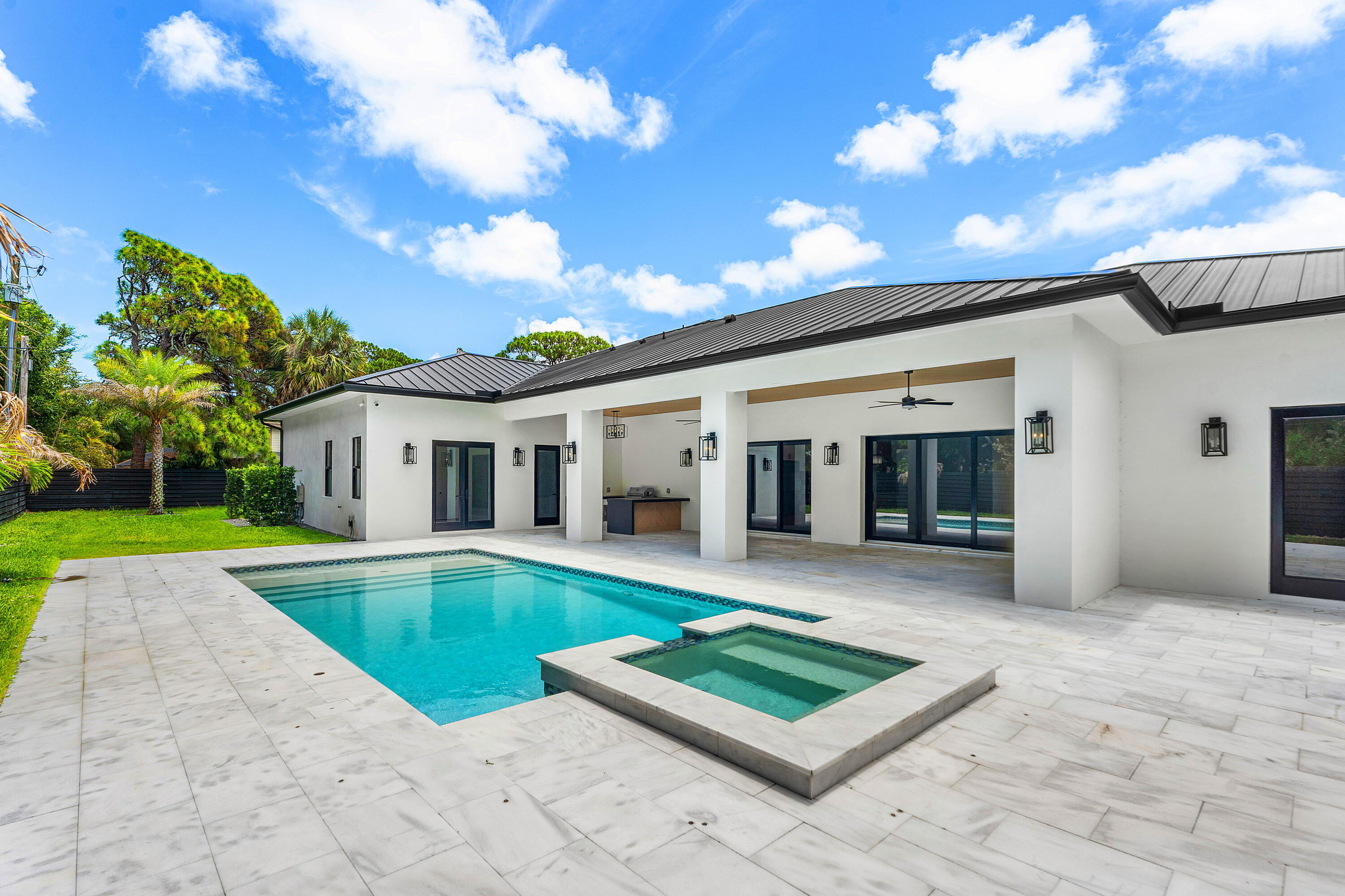 5701 Old Orange Road Jupiter, FL 33458 - Photo 15 of 46 a view of a house with swimming pool and sitting area