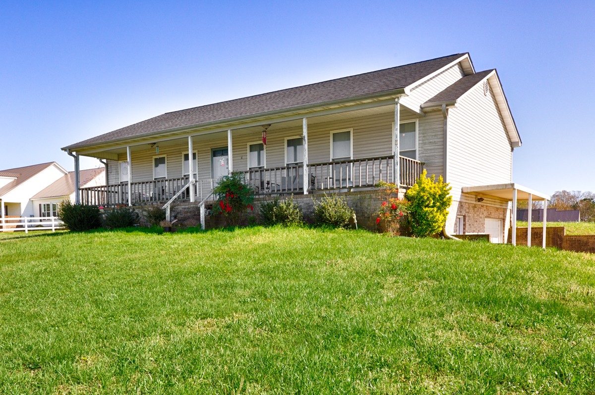 28140 Mitchell Road Ardmore, AL 35739 - Photo 1 of 24 a view of a house with backyard and porch