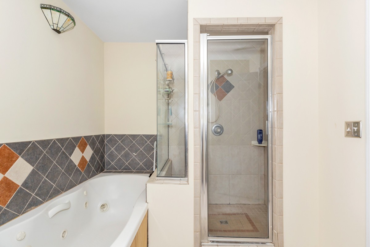 28140 Mitchell Road Ardmore, AL 35739 - Photo 14 of 24 a bathroom with a bathtub and shower