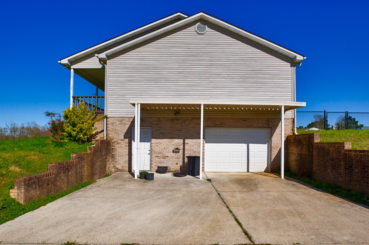 28140 Mitchell Road Ardmore, AL 35739 - Photo 19 of 24 a front view of a house with a yard and garage