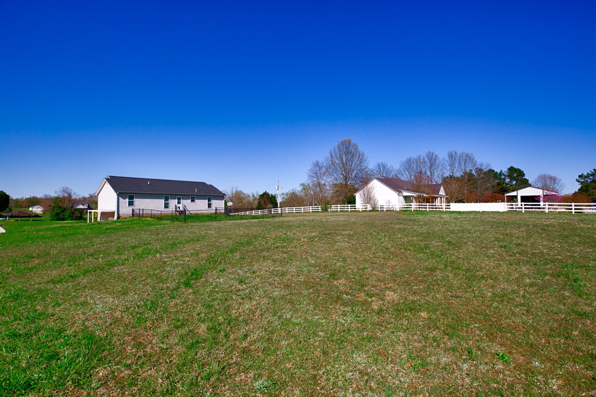 28140 Mitchell Road Ardmore, AL 35739 - Photo 22 of 24 a view of a house with a yard and sitting area