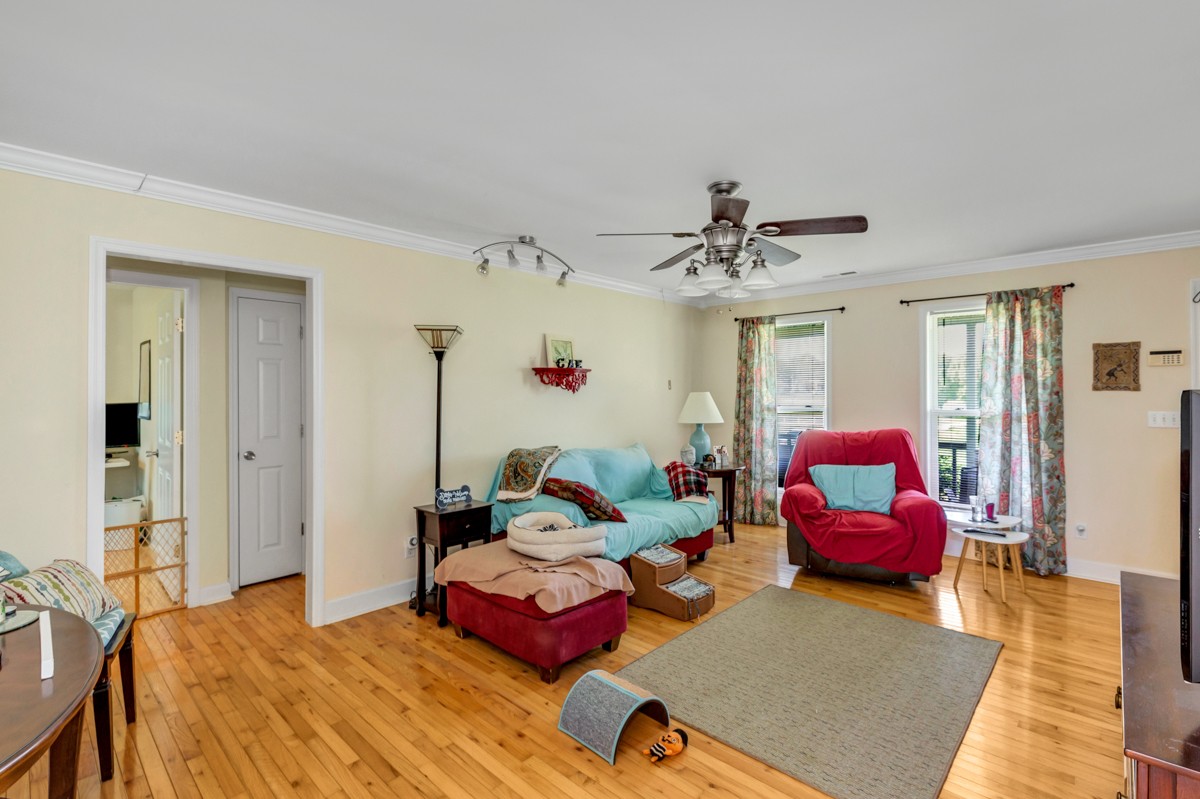 28140 Mitchell Road Ardmore, AL 35739 - Photo 6 of 24 a bedroom with furniture and a chandelier