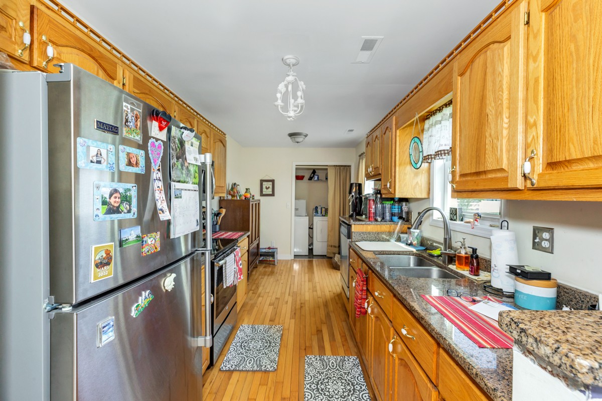 28140 Mitchell Road Ardmore, AL 35739 - Photo 7 of 24 a very nice looking open kitchen with stainless steel appliances granite countertop a refrigerator a stove a sink dishwasher and wooden cabinets with a dining table