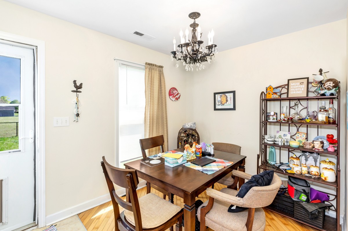 28140 Mitchell Road Ardmore, AL 35739 - Photo 10 of 24 a view of a dining room with furniture and chandelier