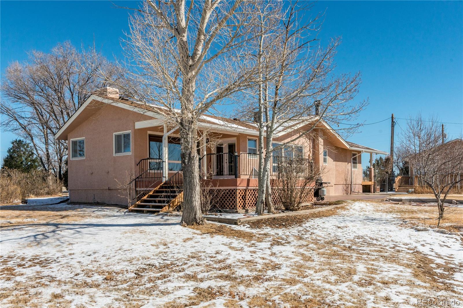 16065 Jones Road Peyton, CO 80831 - Photo 1 of 29 a view of a house with a yard